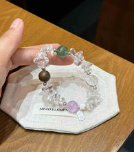 Mixed gemstone bracelet showing Agarwood bead, silver-plated copper spacers and Clear Quartz chip texture