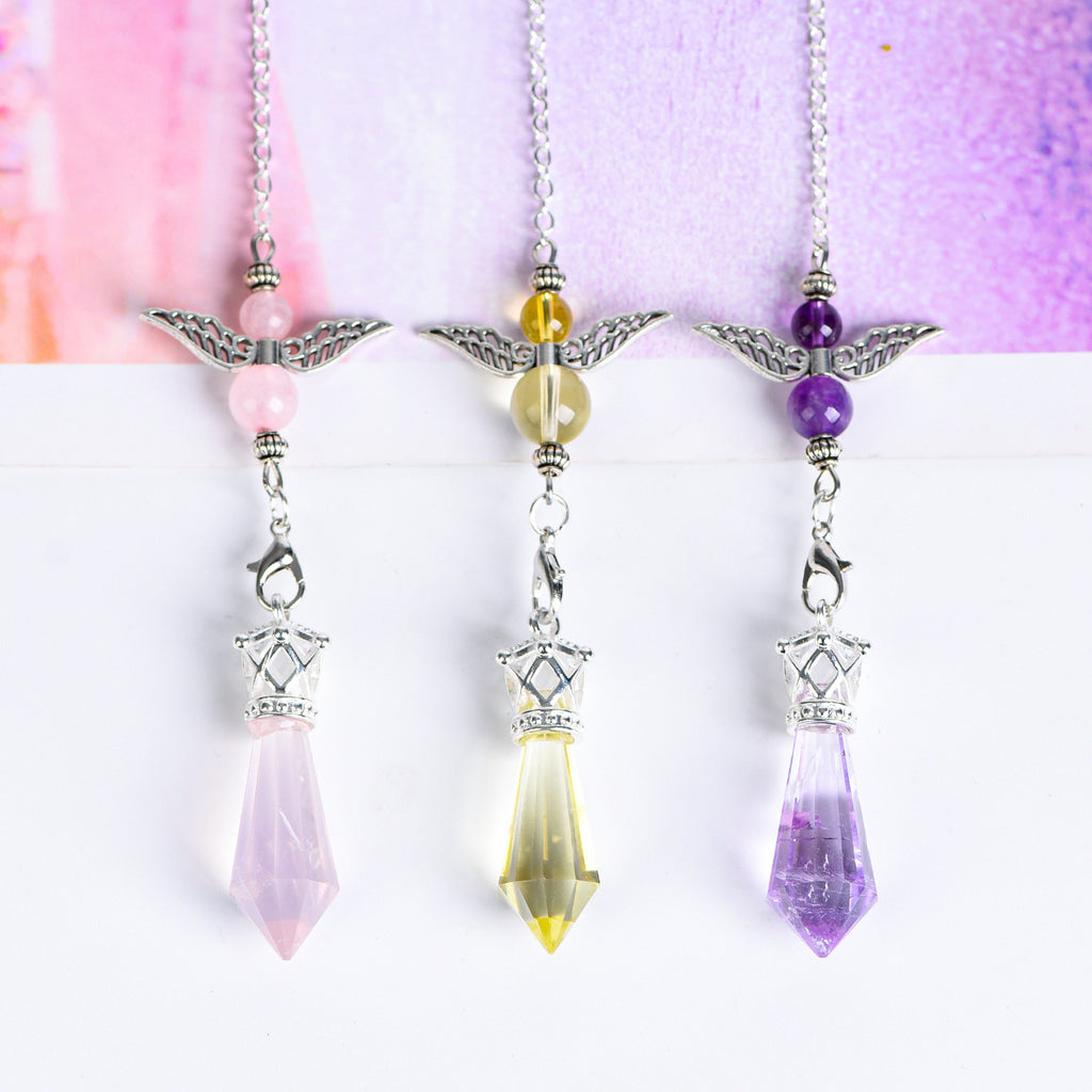 Full view of an Amethyst angel-wing pendulum with silver-tone link chain and faceted crystal point