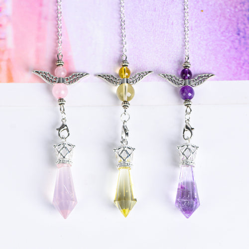 Full view of an Amethyst angel-wing pendulum with silver-tone link chain and faceted crystal point