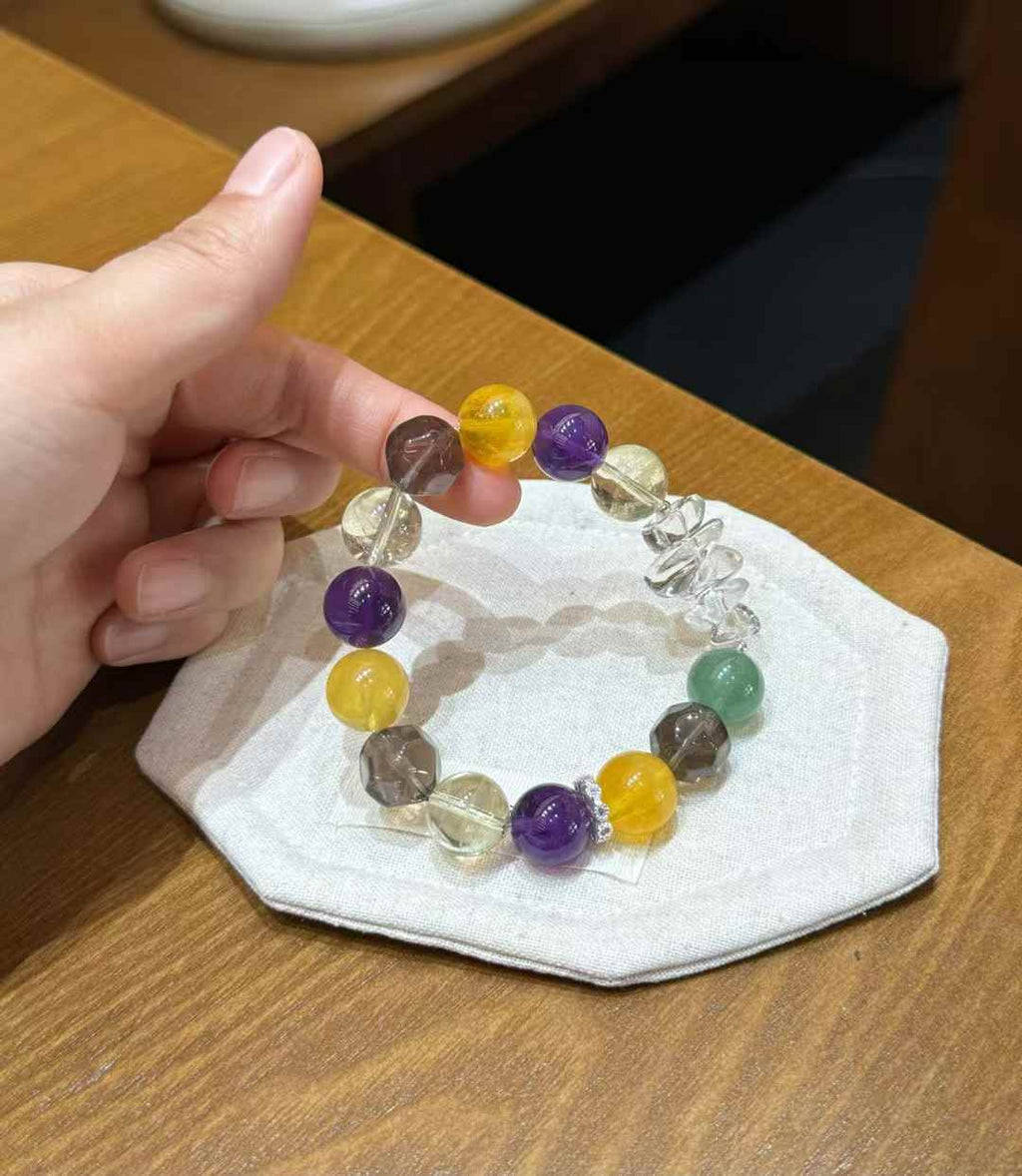 Close view of Brazilian Amethyst, Lemon Citrine, Yellow Fluorite and faceted Smoky Quartz beads