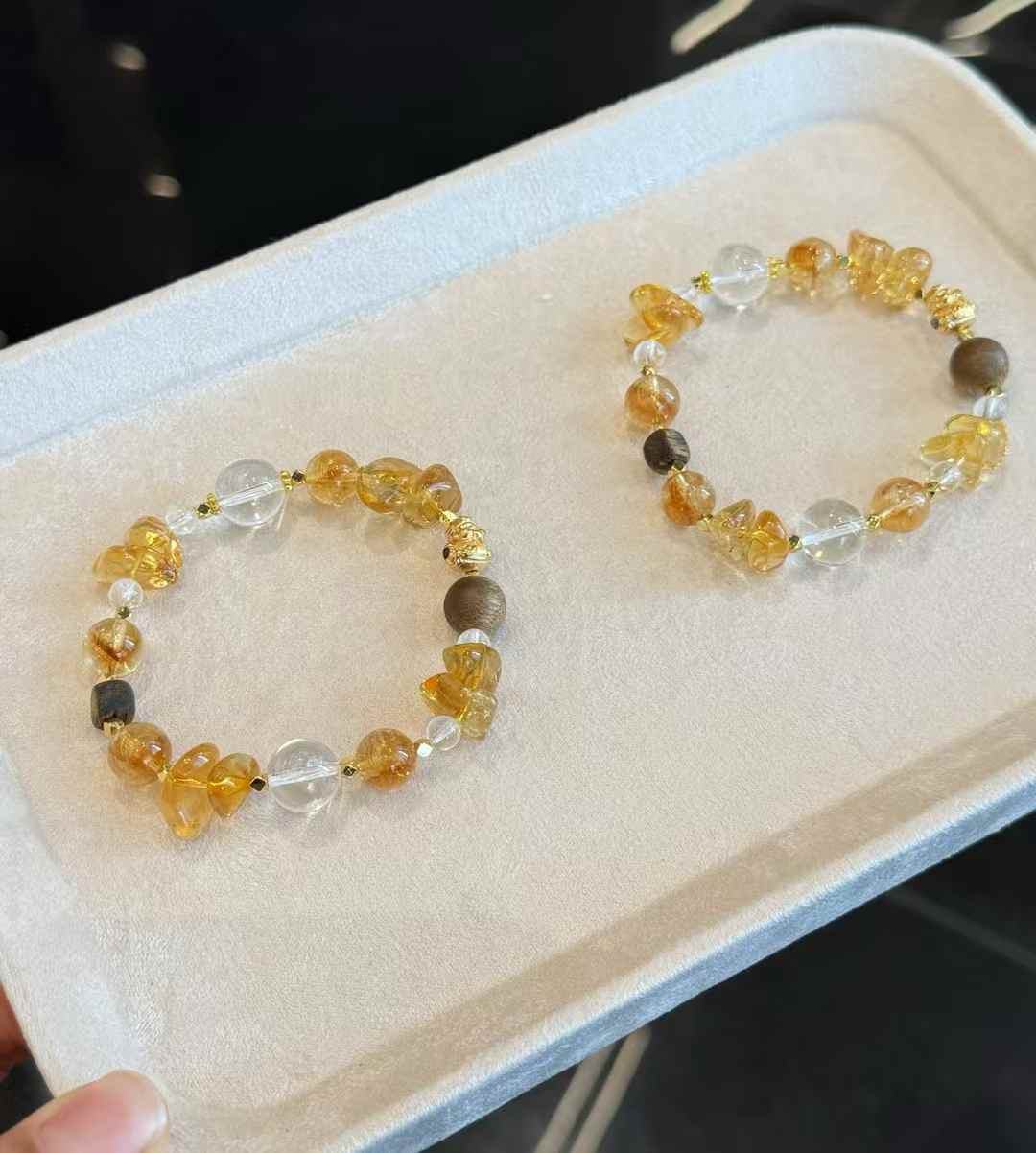 Veridia Brazilian Citrine bracelet with Clear Quartz, Agarwood and gold-plated copper accents held in hand