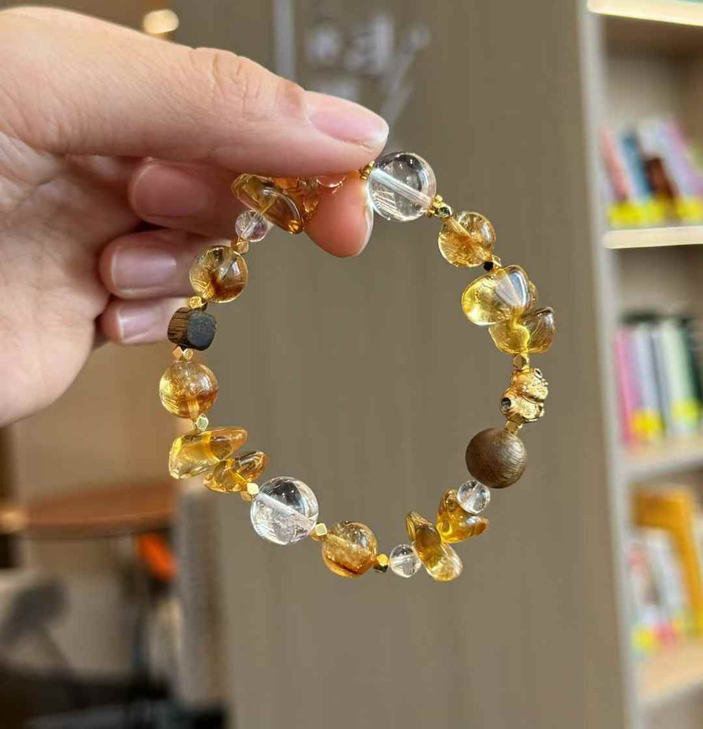 Close-up of Brazilian Citrine round and freeform beads showing warm golden tones and natural internal crystal texture