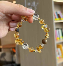 Close-up of Brazilian Citrine round and freeform beads showing warm golden tones and natural internal crystal texture