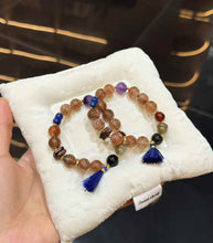 Chinese-inspired color-block gemstone bracelet featuring Super Seven, Amethyst, Lapis Lazuli and dark accents