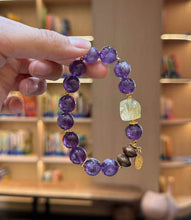 Detail view of the freeform Brazilian Citrine centerpiece, Agarwood beads and gold-tone dangling charm