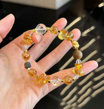 Full view of the Brazilian Citrine and Clear Quartz beaded bracelet with freeform golden crystal pieces and Agarwood accents