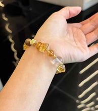 Detail view of gold-plated copper accessories between Brazilian Citrine, Clear Quartz and Agarwood beads