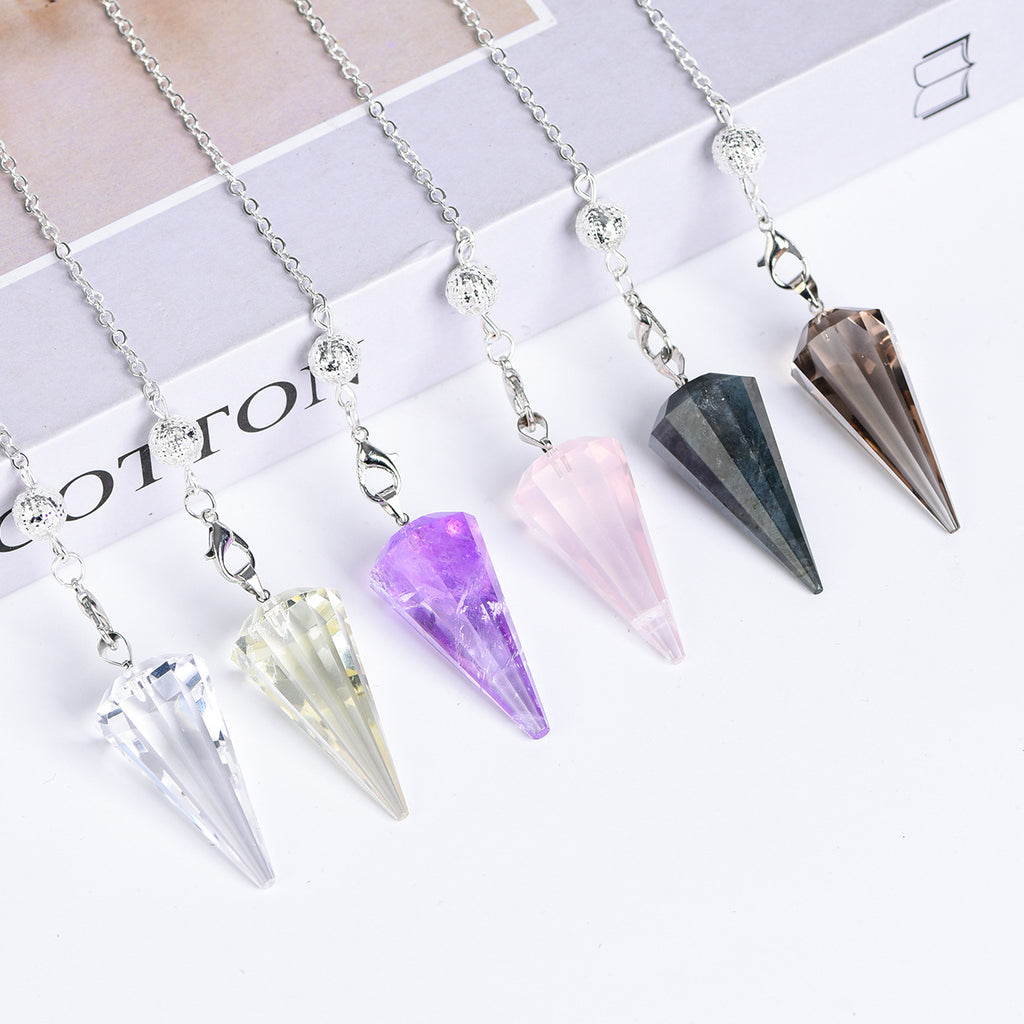 Clear Quartz 12-facet pointed crystal pendulum with silver-tone chain on a white background