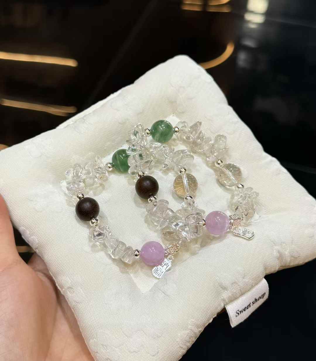 Detail of irregular Clear Quartz chips with soft lavender Kunzite and silver-plated copper charm