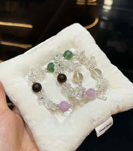 Detail of irregular Clear Quartz chips with soft lavender Kunzite and silver-plated copper charm