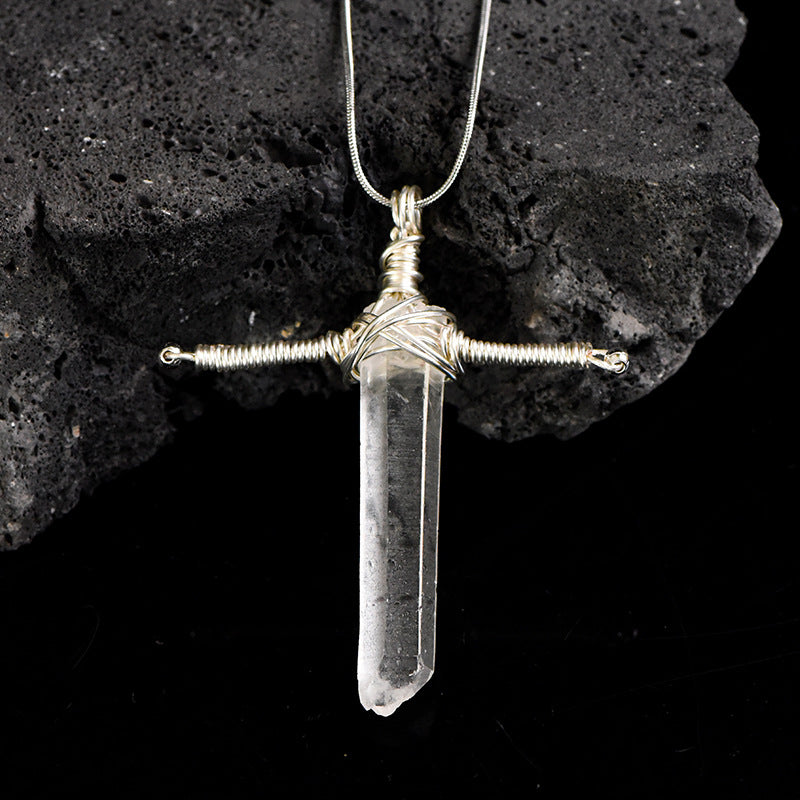 Close-up of the polished Clear Quartz point showing its transparent crystal texture and elongated shape