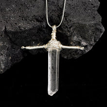 Close-up of the polished Clear Quartz point showing its transparent crystal texture and elongated shape