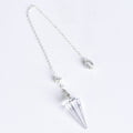 12-facet crystal pendulum displayed beside everyday objects to show its compact scale
