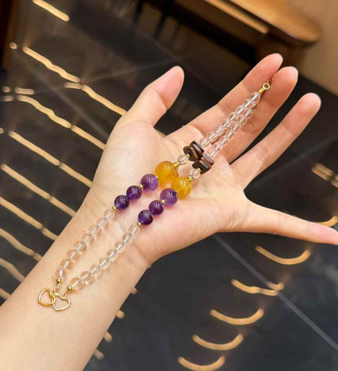 Full view of Clear Quartz double-strand gemstone bracelet with purple Amethyst and golden Yellow Fluorite focal beads