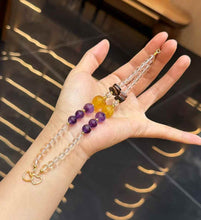 Full view of Clear Quartz double-strand gemstone bracelet with purple Amethyst and golden Yellow Fluorite focal beads