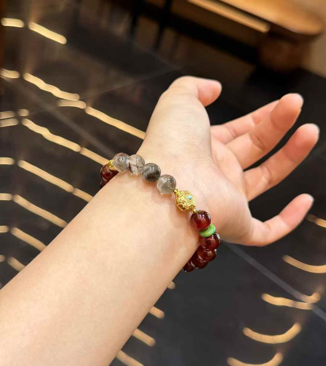 Size reference for the Garnet and Green Phantom Quartz bracelet showing approximately 0.39 inch or 9.8 mm beads