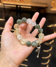 Green Rutilated Quartz and Lemon Quartz bracelet worn on the wrist showing the scale of the large polished beads