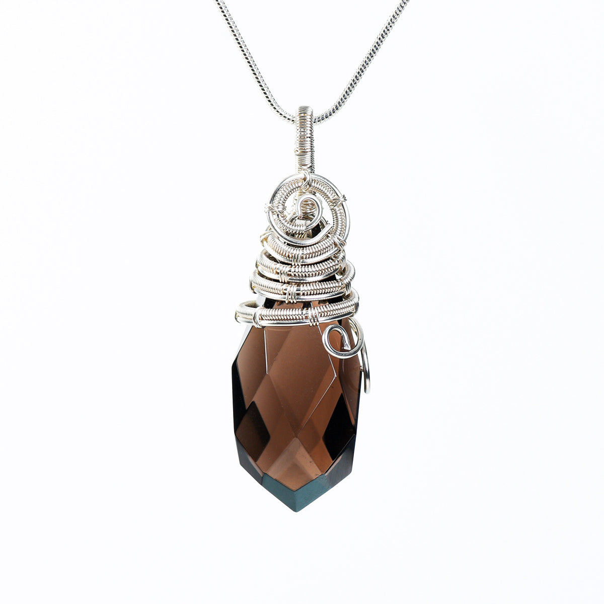 Handmade natural crystal pendant necklace arranged in a clean jewelry gift display
