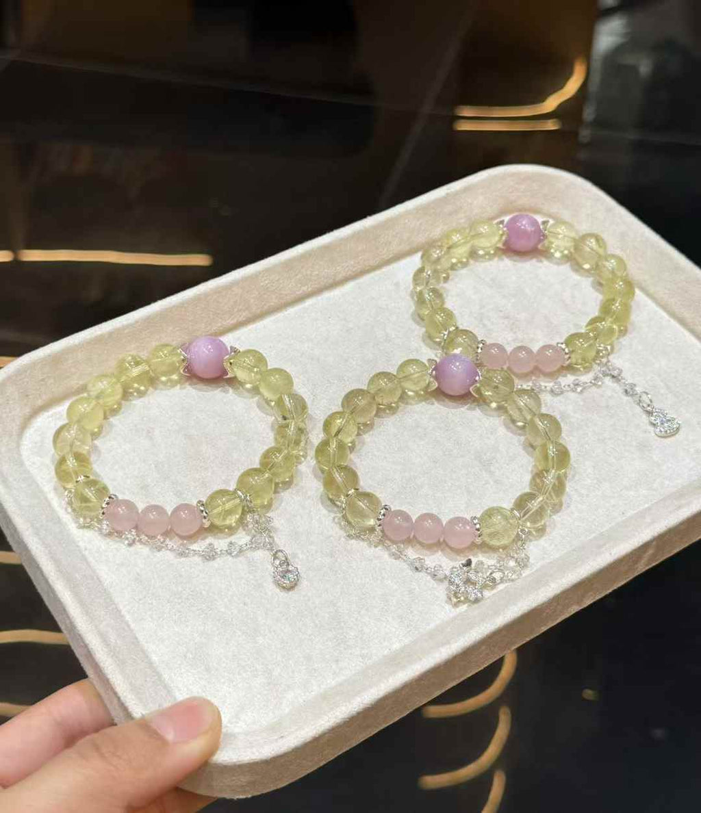 Veridia Lemon Quartz, Kunzite and Rose Quartz bracelets displayed together on a soft tray