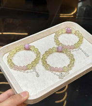 Veridia Lemon Quartz, Kunzite and Rose Quartz bracelets displayed together on a soft tray