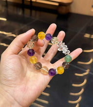 Mixed gemstone bracelet showing irregular Clear Quartz accents among polished multicolor crystal beads