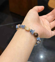 Ocean-inspired Blue Crystal bracelet worn on the wrist showing its elegant everyday scale and mixed bead design