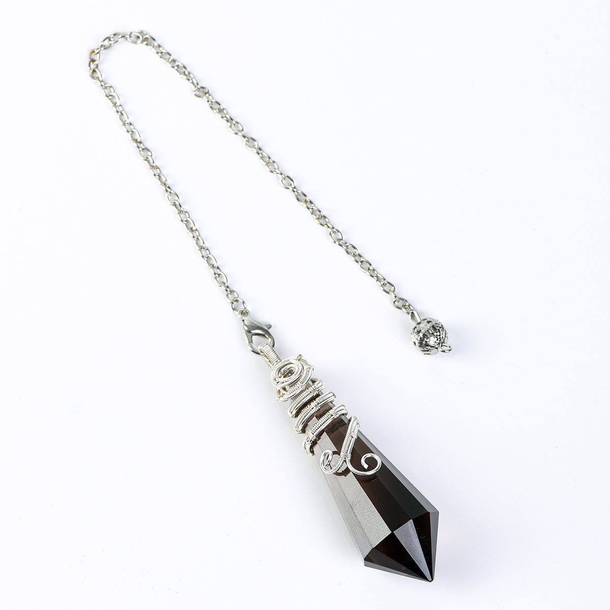 Pointed 12-facet crystal pendulum highlighting its directional geometric shape and decorative wire-wrapped design
