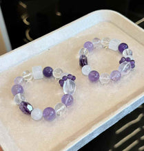 Two matching purple mixed-crystal bracelets displayed together for style and bead arrangement comparison