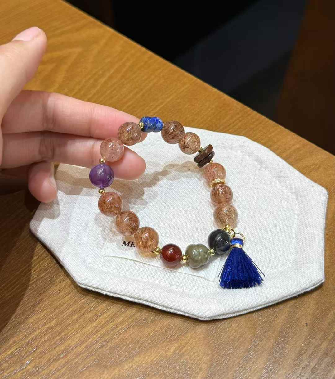 Size reference for mixed gemstone bracelet showing approximately 0.43 inch or 10.8 mm main beads