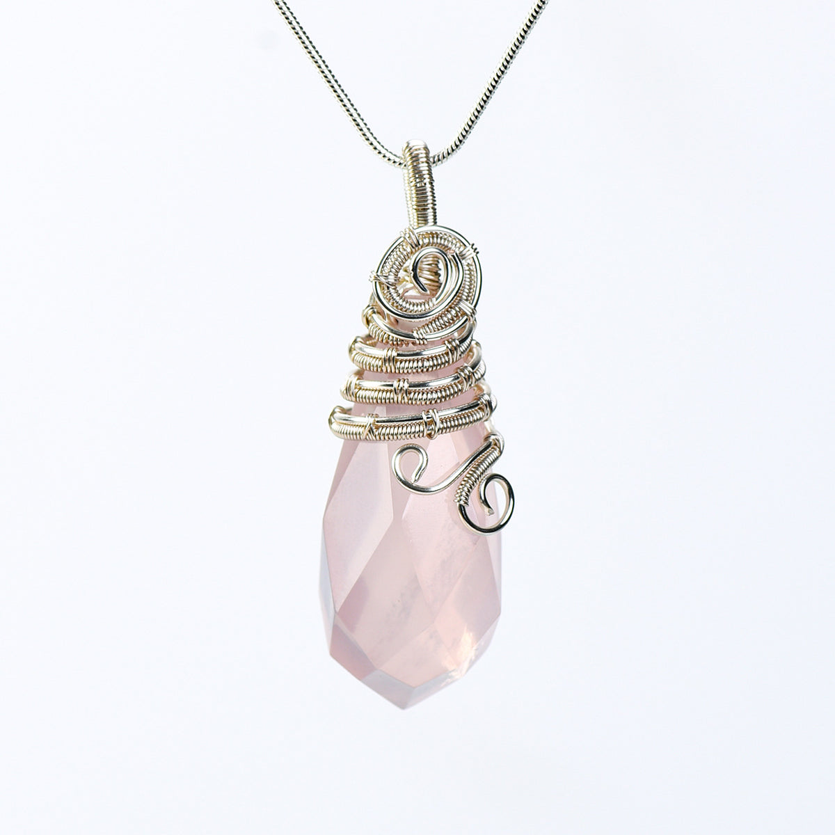 Handmade wire-wrapped crystal pendant necklace worn at the neckline to show its statement scale