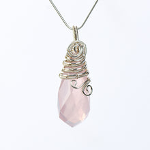 Handmade wire-wrapped crystal pendant necklace worn at the neckline to show its statement scale