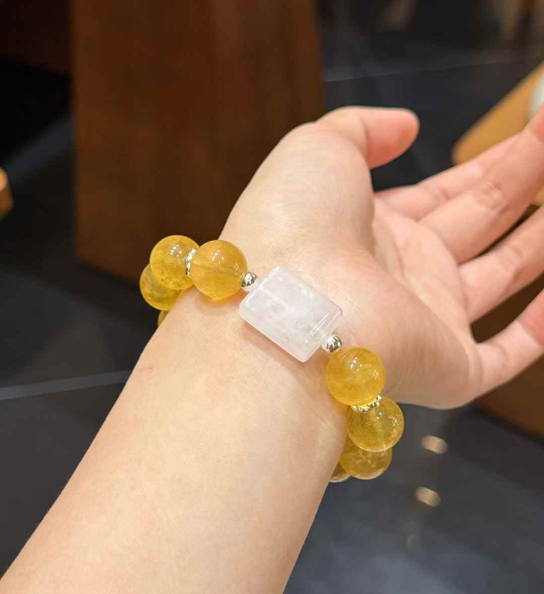 Close-up detail of Yellow Fluorite beads showing the bright translucent texture and internal pattern