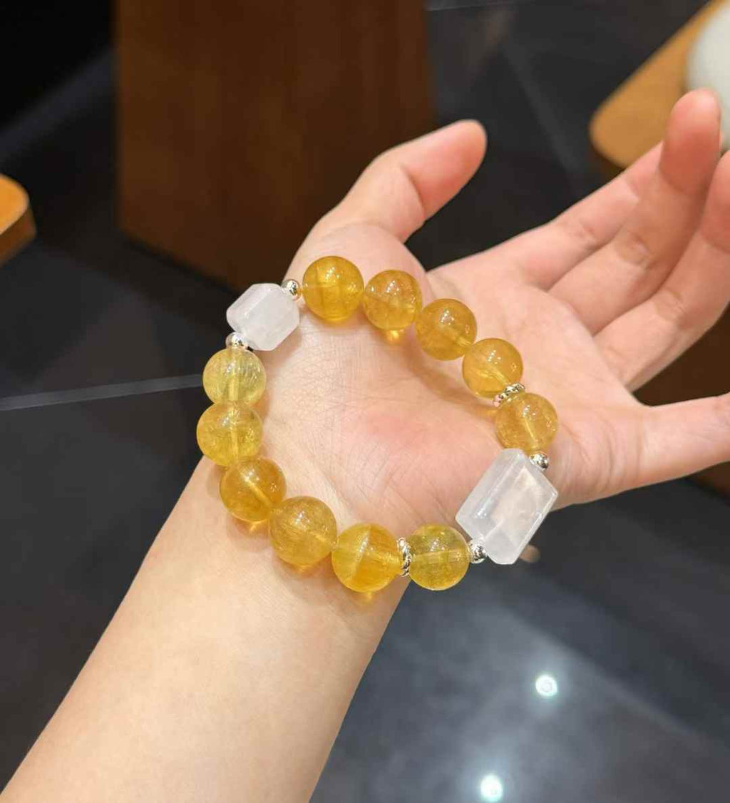 Multiple Yellow Fluorite and White Phantom bracelets displayed together for style comparison