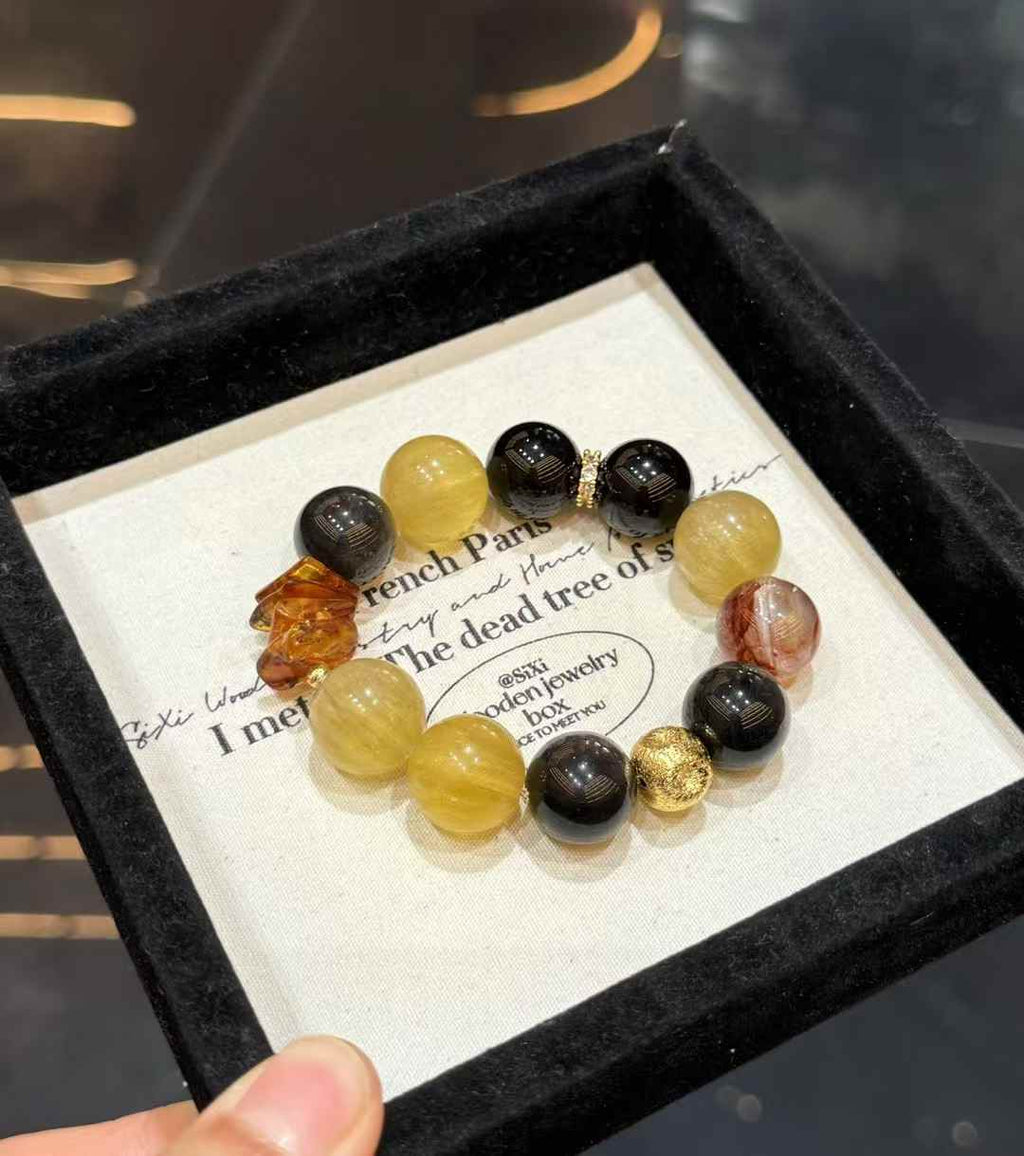 Veridia statement bracelet with Yellow Fluorite, Silver Sheen Obsidian, Red Hematoid Quartz and amber accents