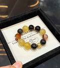Veridia statement bracelet with Yellow Fluorite, Silver Sheen Obsidian, Red Hematoid Quartz and amber accents