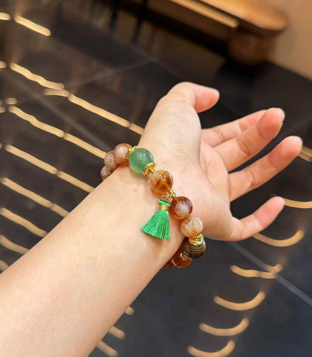 Close view of warm Yellow Tower Crystal beads with translucent Green Strawberry Quartz accent