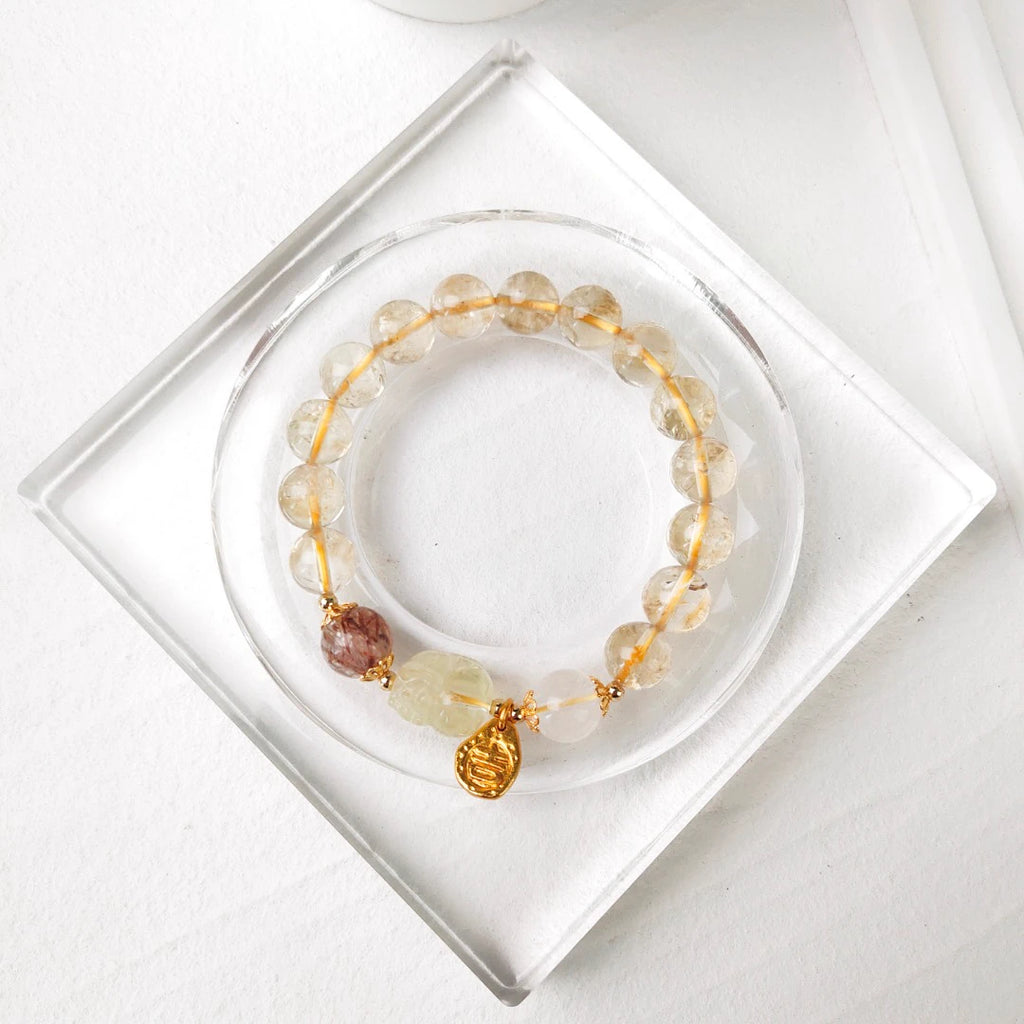 Antique Inspired Polished Gold Tone Drop Charm with Traditional Character Embossing