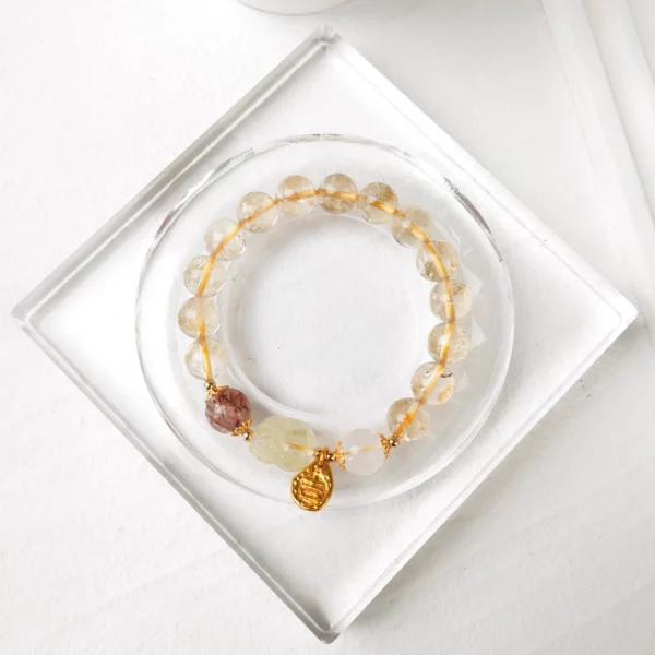 Antique Inspired Polished Gold Tone Drop Charm with Traditional Character Embossing