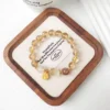 Minimalist Studio Shot of Luminous Translucent Yellow Beaded Fine Strand Wristlet